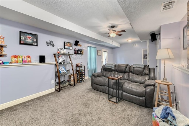 4316 Grand Ave, Leavenworth, KS 66048 - carpeted living area with a ceiling fan, a textured ceiling, and baseboards