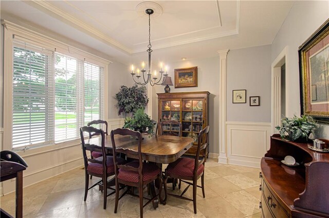 18765 S Alden St, Olathe, KS 66062 - dining space with a tray ceiling, a chandelier, a decorative wall, a wainscoted wall, and crown molding