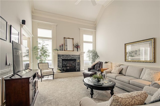 18765 S Alden St, Olathe, KS 66062 - carpeted living area with ornamental molding, plenty of natural light, a stone fireplace, a ceiling fan, and lofted ceiling