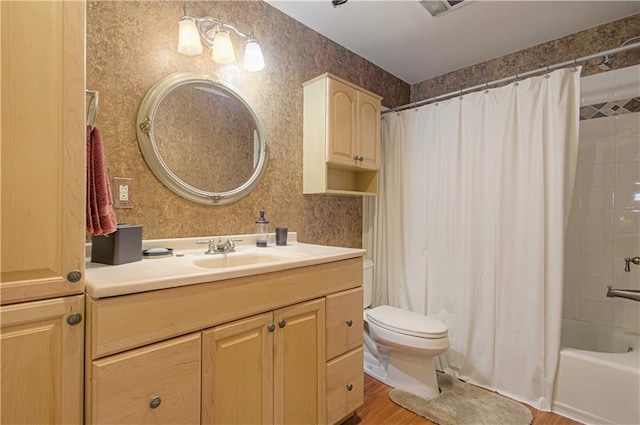 18765 S Alden St, Olathe, KS 66062 - bathroom with vanity, shower / bathtub combination with curtain, and wood finished floors