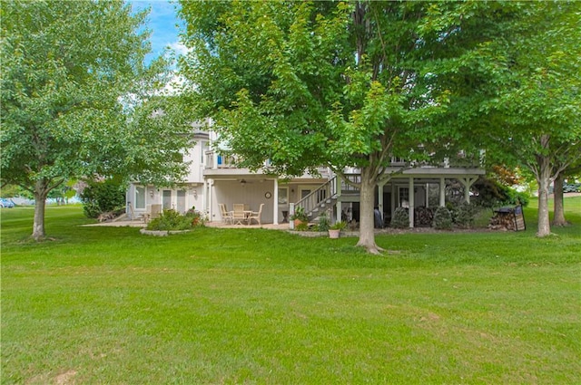 18765 S Alden St, Olathe, KS 66062 - view of grassy yard featuring a patio and stairs