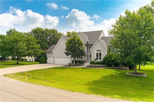 18765 S Alden St, Olathe, KS 66062 - view of front of property featuring concrete driveway, a garage, and a front lawn