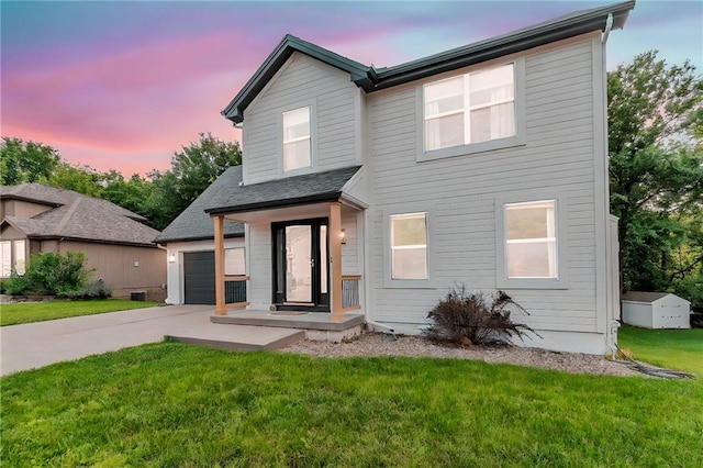 1610 Renea Ct, Kearney, MO 64060 - view of front facade with a yard, a garage, and driveway