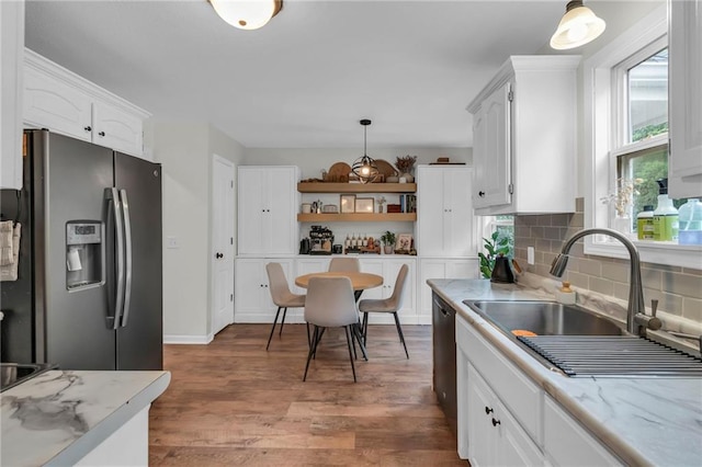 1610 Renea Ct, Kearney, MO 64060 - kitchen featuring stainless steel fridge with ice dispenser, a sink, open shelves, white cabinets, and tasteful backsplash