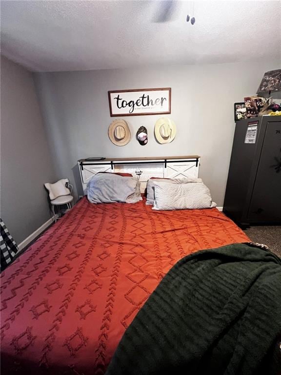 414 S 3rd St, Humboldt, KS 66748 - bedroom with carpet flooring, a ceiling fan, and a textured ceiling