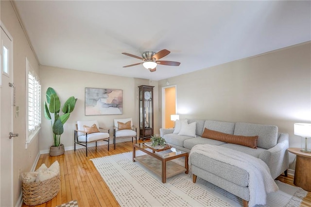 115 NE Green St, Lees Summit, MO 64063 - living area with light wood-style flooring and a ceiling fan