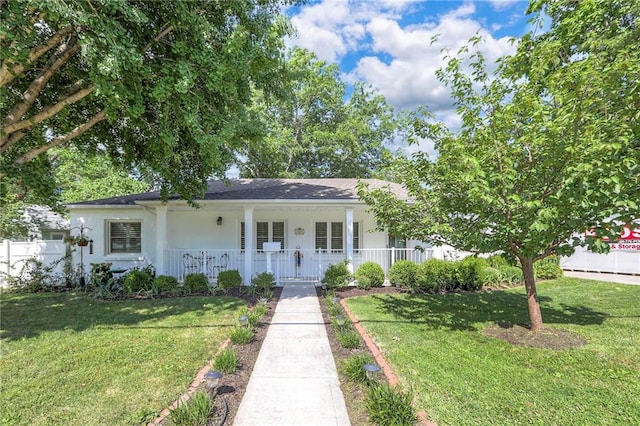 115 NE Green St, Lees Summit, MO 64063 - view of front facade with covered porch, a front yard, and stucco siding