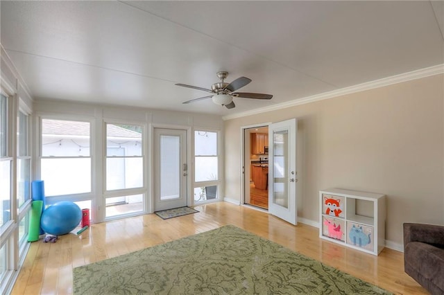 115 NE Green St, Lees Summit, MO 64063 - interior space with crown molding, wood finished floors, and ceiling fan