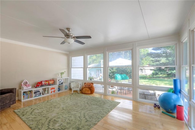 115 NE Green St, Lees Summit, MO 64063 - recreation room featuring wood-type flooring, ceiling fan, and crown molding