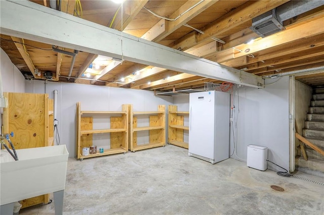 115 NE Green St, Lees Summit, MO 64063 - unfinished below grade area with freestanding refrigerator and stairs