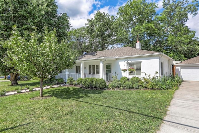 115 NE Green St, Lees Summit, MO 64063 - view of front of property with stucco siding, a front yard, a garage, and a porch