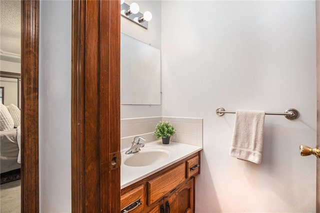 307 E Gore Rd, Raymore, MO 64083 - bathroom featuring vanity and backsplash
