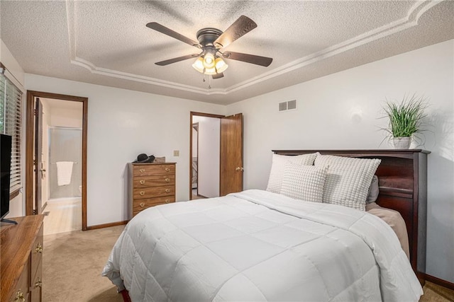 307 E Gore Rd, Raymore, MO 64083 - bedroom featuring a tray ceiling, a textured ceiling, carpet, ceiling fan, and baseboards