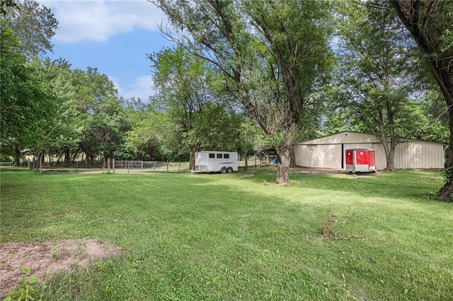 307 E Gore Rd, Raymore, MO 64083 - view of yard with an outbuilding