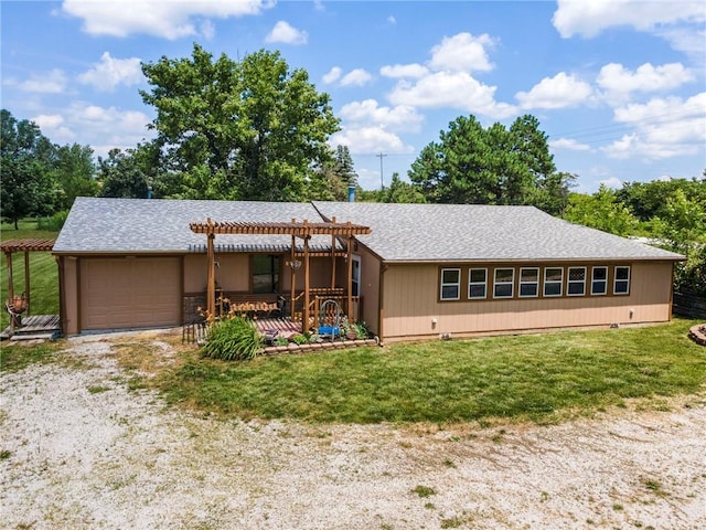 5470 SE Downing Rd, Lathrop, MO 64465 - single story home featuring a pergola, an attached garage, a front lawn, and driveway