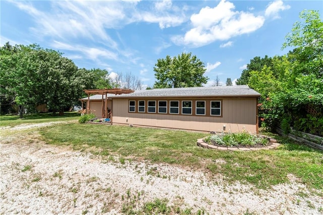 5470 SE Downing Rd, Lathrop, MO 64465 - rear view of house featuring a lawn