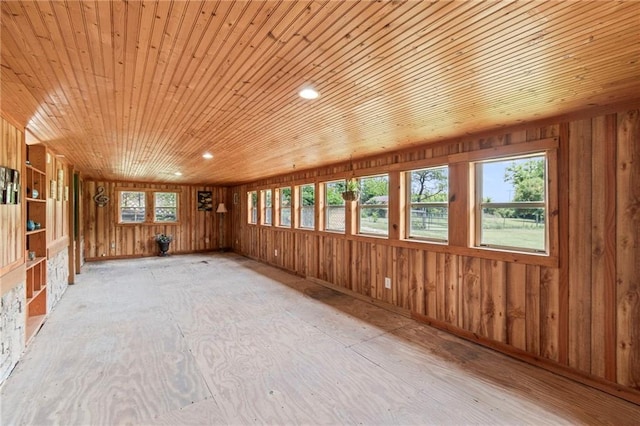 5470 SE Downing Rd, Lathrop, MO 64465 - empty room featuring healthy amount of natural light, wood ceiling, wood walls, and recessed lighting