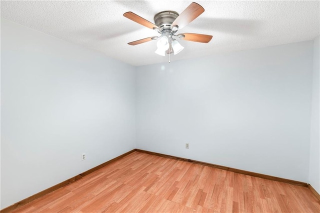 5470 SE Downing Rd, Lathrop, MO 64465 - spare room with light wood-type flooring, ceiling fan, and a textured ceiling