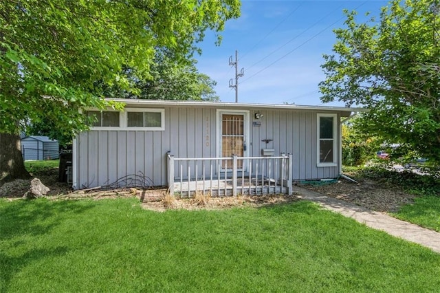 11120 E 35th Ter, Independence, MO 64052 - view of front of house featuring a front lawn and board and batten siding