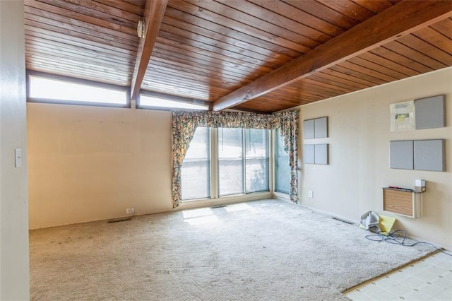 11120 E 35th Ter, Independence, MO 64052 - empty room with plenty of natural light, a wood ceiling with exposed beams, and carpet floors