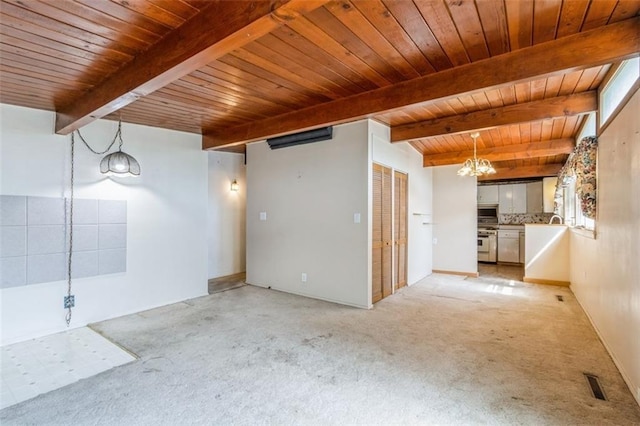11120 E 35th Ter, Independence, MO 64052 - spare room with a wooden ceiling with exposed beams, light carpet, and a chandelier