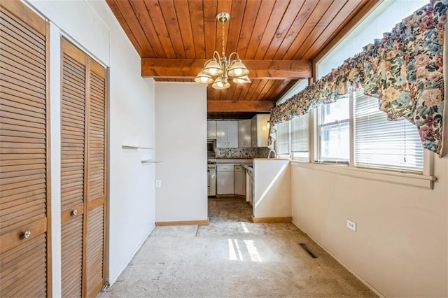 11120 E 35th Ter, Independence, MO 64052 - kitchen with a chandelier, light colored carpet, a wooden ceiling with exposed beams, decorative backsplash, and hanging light fixtures