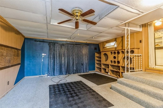 11120 E 35th Ter, Independence, MO 64052 - misc room featuring wooden walls, ceiling fan, carpet flooring, and a paneled ceiling