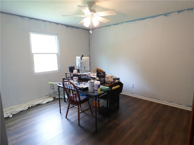 520 N Jefferson St, Raymore, MO 64030 - home office with a ceiling fan, dark wood-style flooring, and baseboards