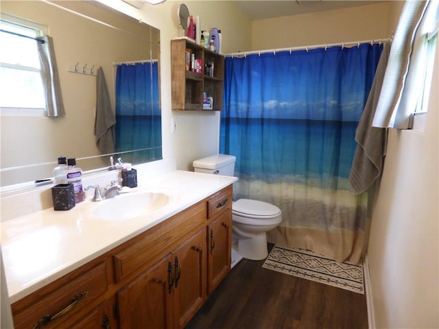 520 N Jefferson St, Raymore, MO 64030 - bathroom with toilet, vanity, wood finished floors, and curtained shower