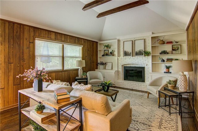 9920 Juniper Ln, Overland Park, KS 66207 - living room featuring wood walls, wood finished floors, and a fireplace