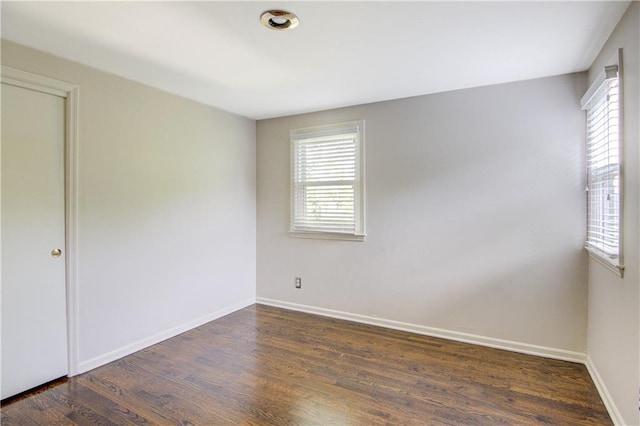 9920 Juniper Ln, Overland Park, KS 66207 - empty room with wood finished floors and baseboards