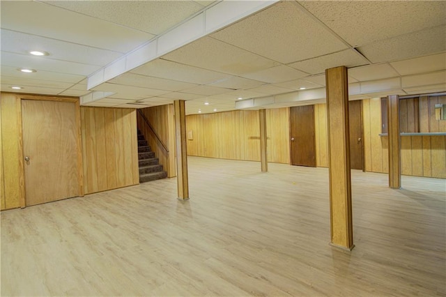 9920 Juniper Ln, Overland Park, KS 66207 - finished basement featuring wood finished floors, stairway, wood walls, a paneled ceiling, and recessed lighting