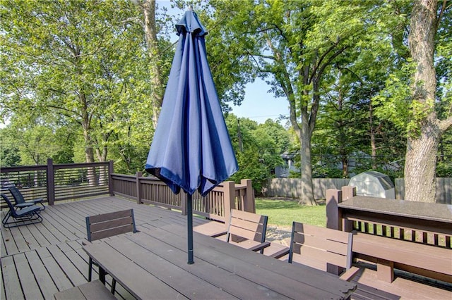 9920 Juniper Ln, Overland Park, KS 66207 - deck with a fenced backyard, grilling area, and view of scattered trees