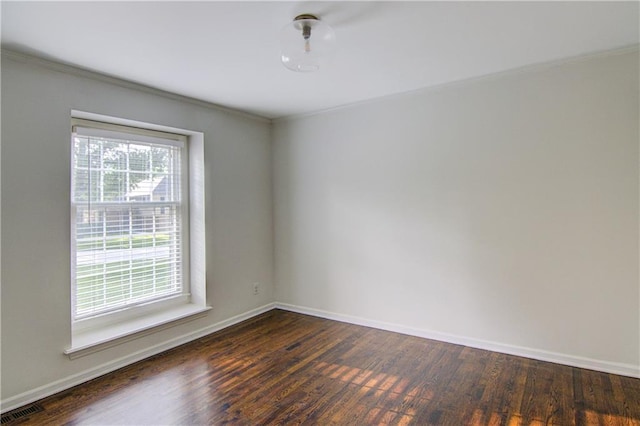 9920 Juniper Ln, Overland Park, KS 66207 - unfurnished room with crown molding, baseboards, and dark wood-style floors