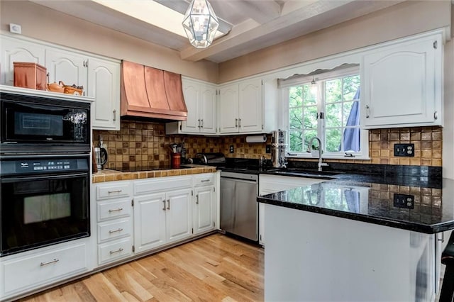 732 W 121st St, Kansas City, MO 64145 - kitchen featuring black appliances, custom range hood, white cabinetry, and a peninsula