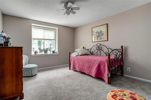 732 W 121st St, Kansas City, MO 64145 - carpeted bedroom with a ceiling fan and a textured ceiling