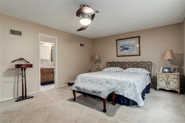 732 W 121st St, Kansas City, MO 64145 - bedroom with light carpet, ceiling fan, and ensuite bath