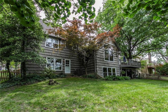 732 W 121st St, Kansas City, MO 64145 - back of house with a wooden deck