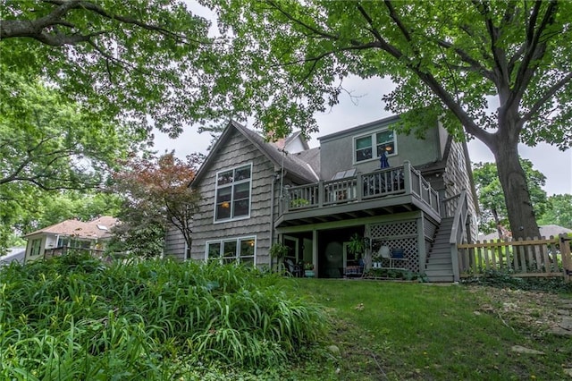 732 W 121st St, Kansas City, MO 64145 - back of house with a wooden deck