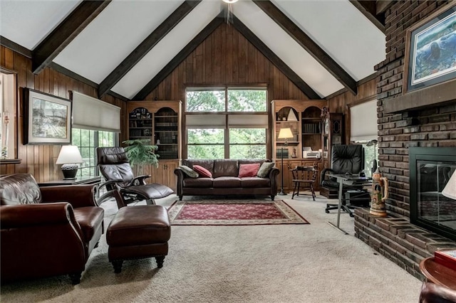 732 W 121st St, Kansas City, MO 64145 - carpeted living room featuring wooden walls, a fireplace, healthy amount of natural light, beamed ceiling, and high vaulted ceiling