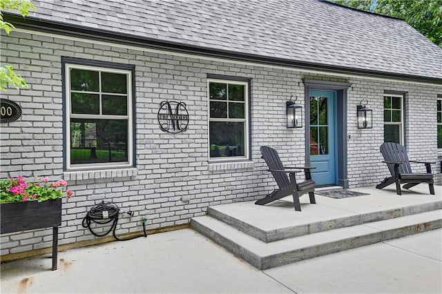 3200 NW 51st Ter, Blue Springs, MO 64015 - property entrance featuring roof with shingles and brick siding