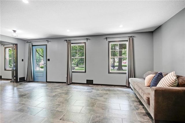 3200 NW 51st Ter, Blue Springs, MO 64015 - living area featuring recessed lighting and stone tile flooring