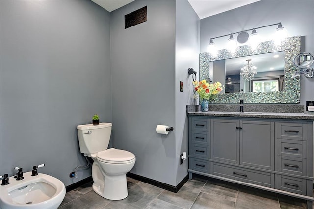 3200 NW 51st Ter, Blue Springs, MO 64015 - bathroom with a bidet, vanity, a chandelier, and tile patterned floors