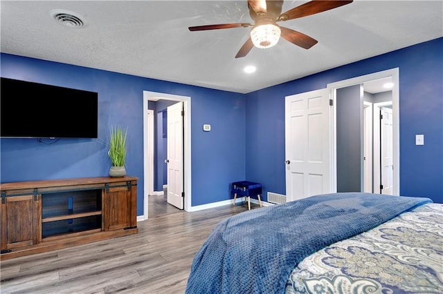 3200 NW 51st Ter, Blue Springs, MO 64015 - bedroom with wood finished floors and ceiling fan