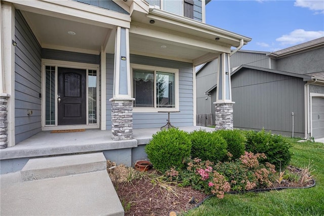 1532 SW Cross Creek Dr, Lees Summit, MO 64082 - property entrance with covered porch, an attached garage, and stone siding