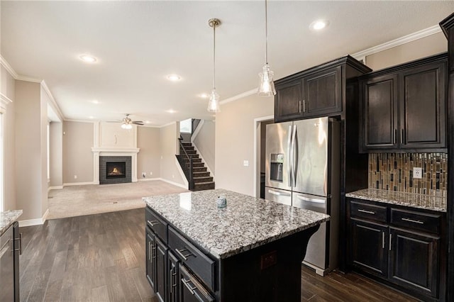 1532 SW Cross Creek Dr, Lees Summit, MO 64082 - kitchen featuring stainless steel fridge with ice dispenser, ceiling fan, tasteful backsplash, a center island, and crown molding