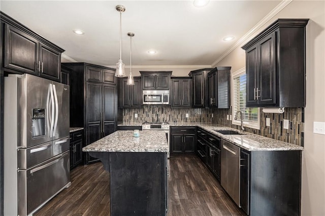 1532 SW Cross Creek Dr, Lees Summit, MO 64082 - kitchen with appliances with stainless steel finishes, ornamental molding, a center island, dark wood-style flooring, and tasteful backsplash