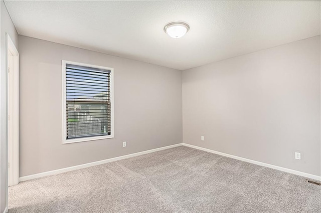 1532 SW Cross Creek Dr, Lees Summit, MO 64082 - spare room featuring carpet and baseboards