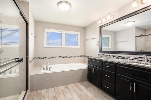 1532 SW Cross Creek Dr, Lees Summit, MO 64082 - bathroom featuring a garden tub, a shower stall, and double vanity