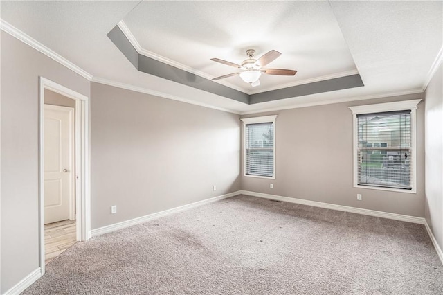 1532 SW Cross Creek Dr, Lees Summit, MO 64082 - carpeted spare room with a raised ceiling, plenty of natural light, a ceiling fan, and crown molding